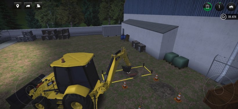 Digging up mud to uncover soil in a yellow construction vehicle