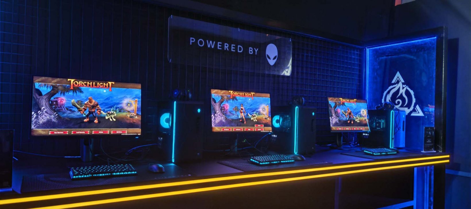a series of computers setup with torchlight on screen