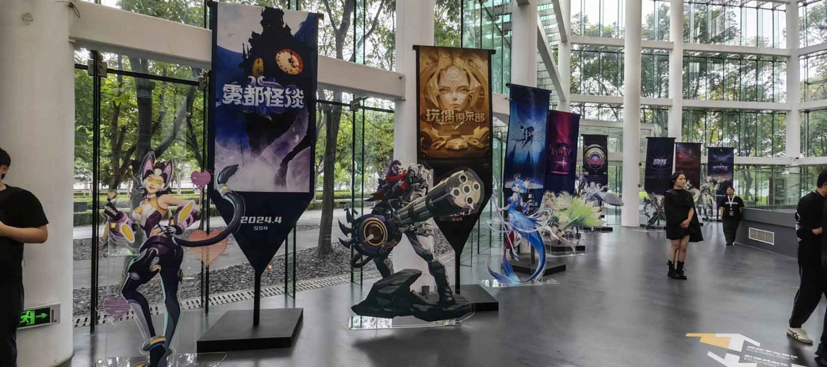 a series of acrylic stands and banners depicting torchlight infinite seasons
