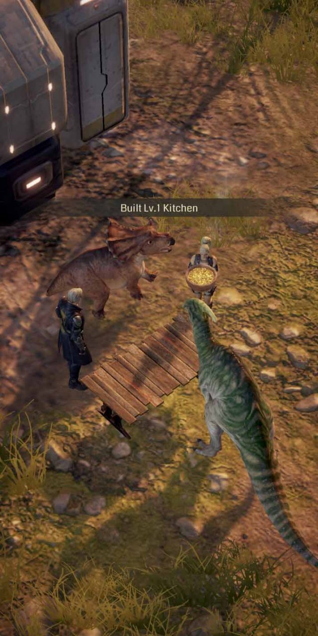 two humans feeding two dinosurs