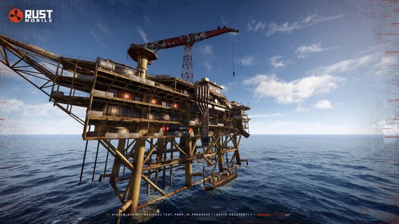 A canted image of an oil right in the midst of a blue ocean, it looks a bit run down.