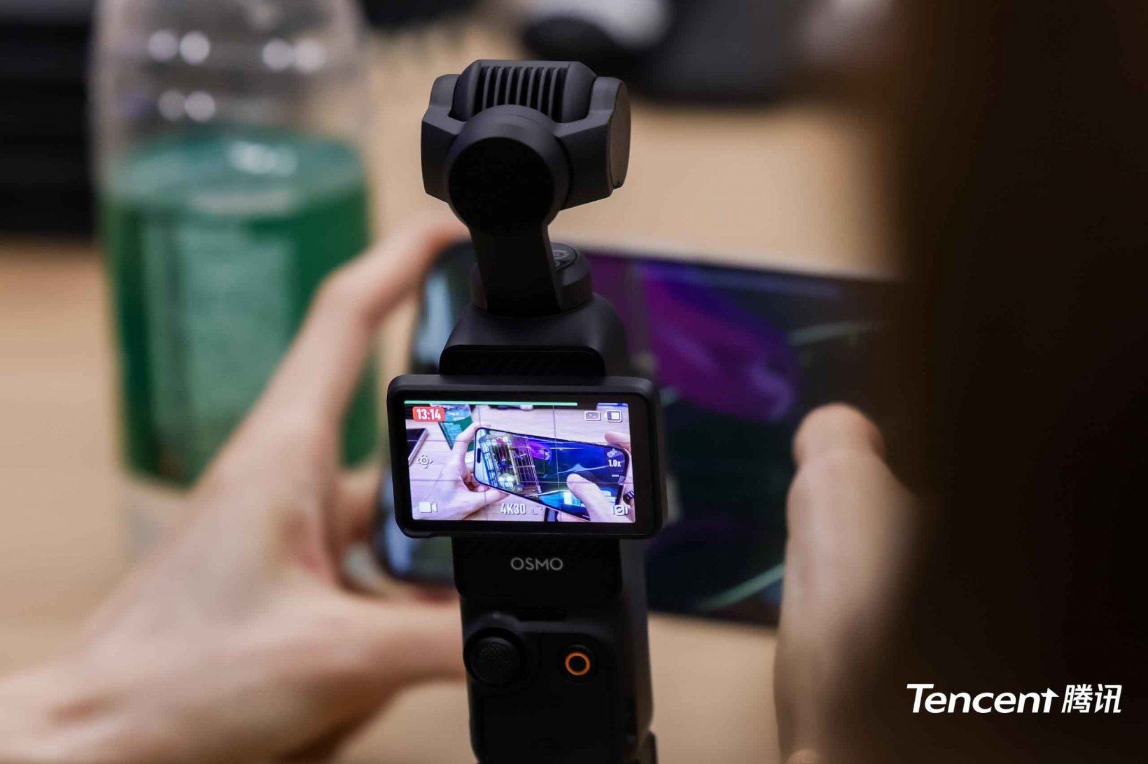 dji osmo pocket shooting footage of chasing kaleidorider on a phone