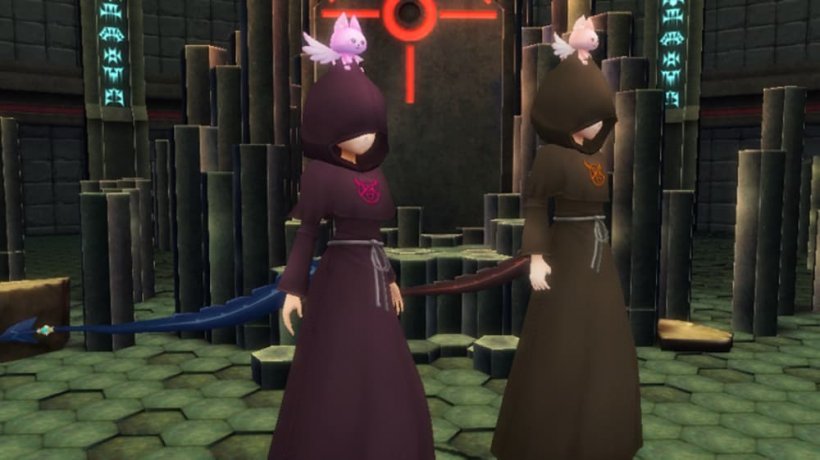 A picture of two mysterious individuals wearing hooded robes.