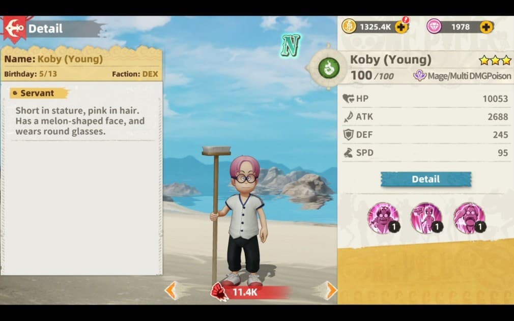 Young Koby stands on the beach holding a broom in one hand