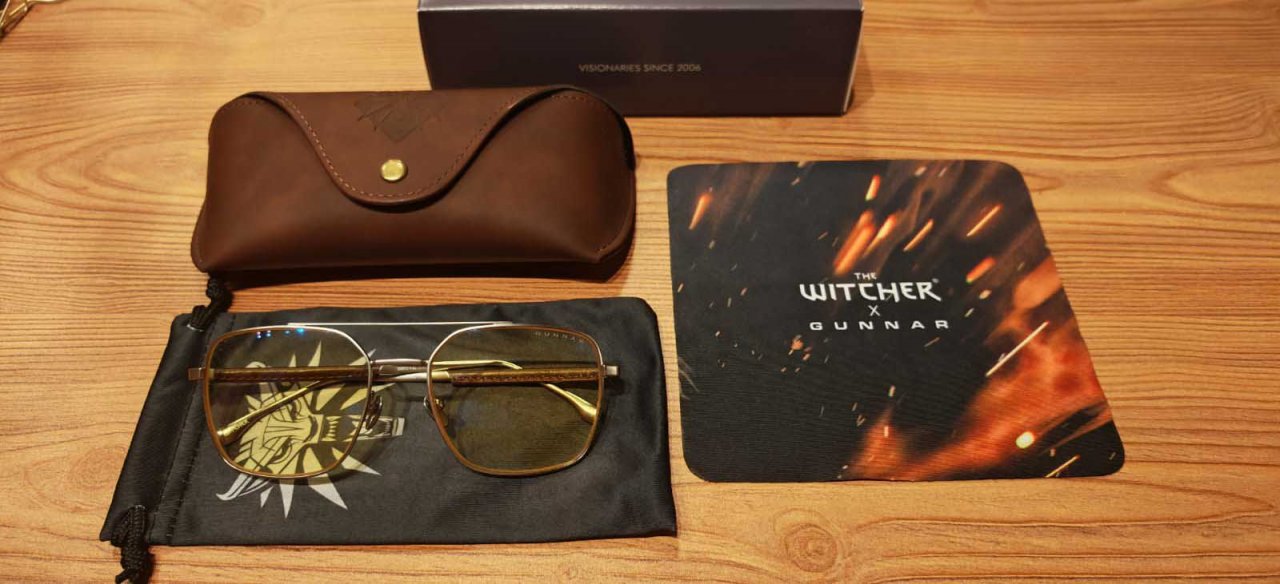 glasses with a leather case and pouch on a table