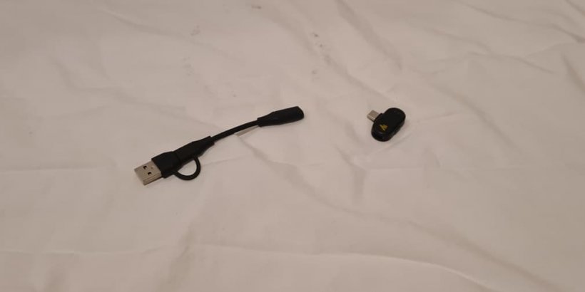 A picture of a USB cable with transmitter dongle unattached.