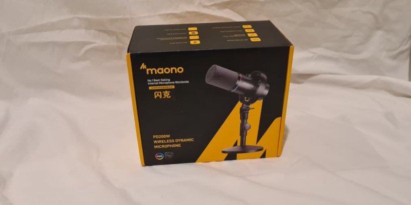 A yellow and black box featuring a microphone on it.