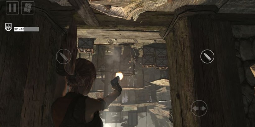 Lara stuck hanging upside down in a trap while shooting enemies