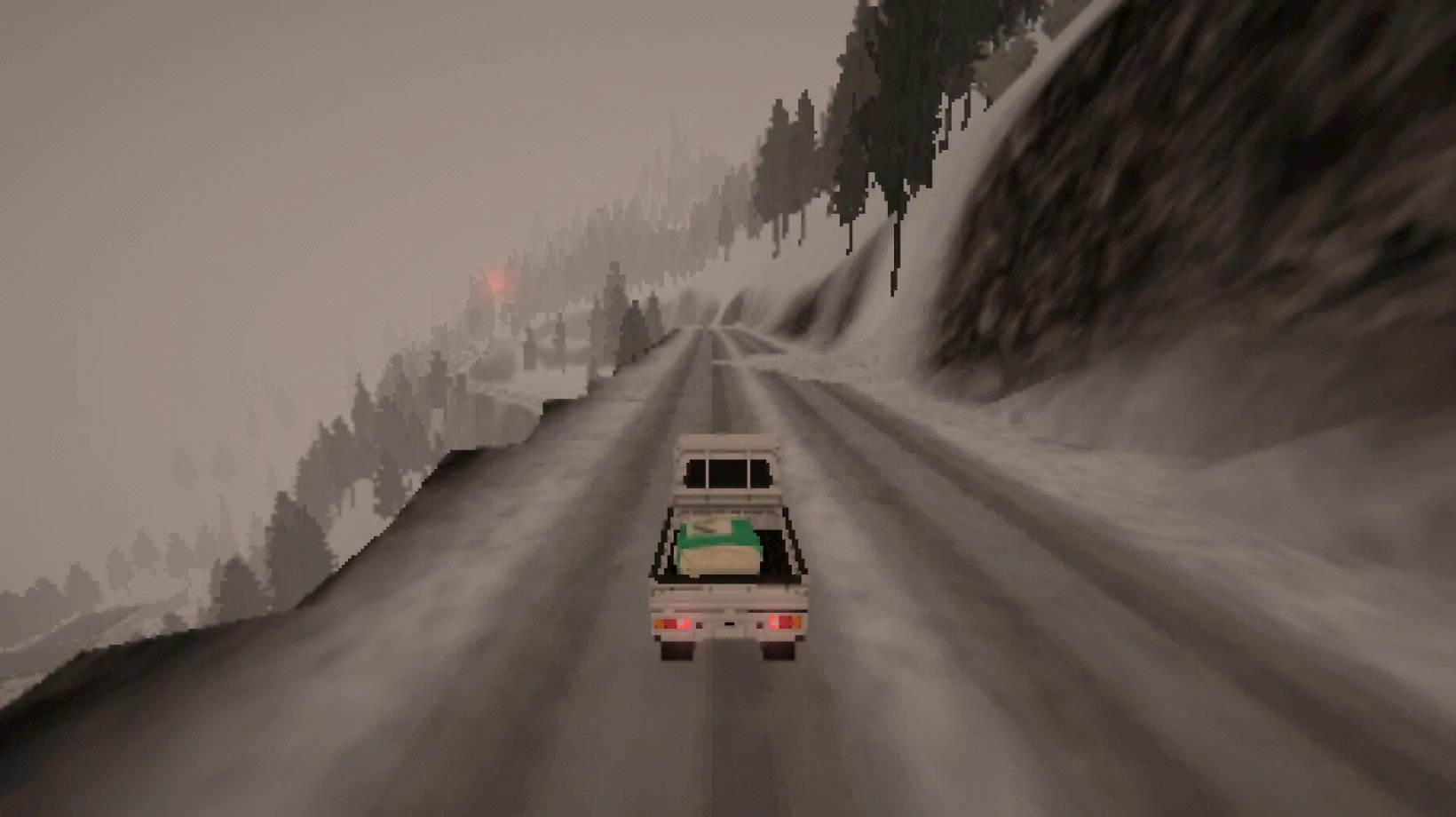 a truck on the road in the snow