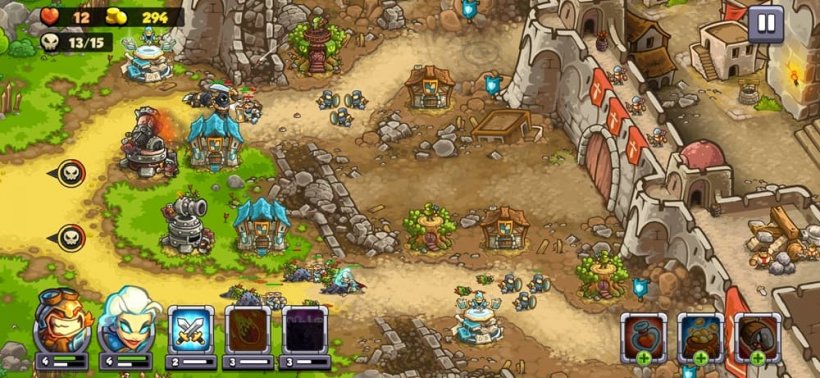 A large broken fortress is defended by small towers, with the walls broken through and enemies funelled through the gaps.