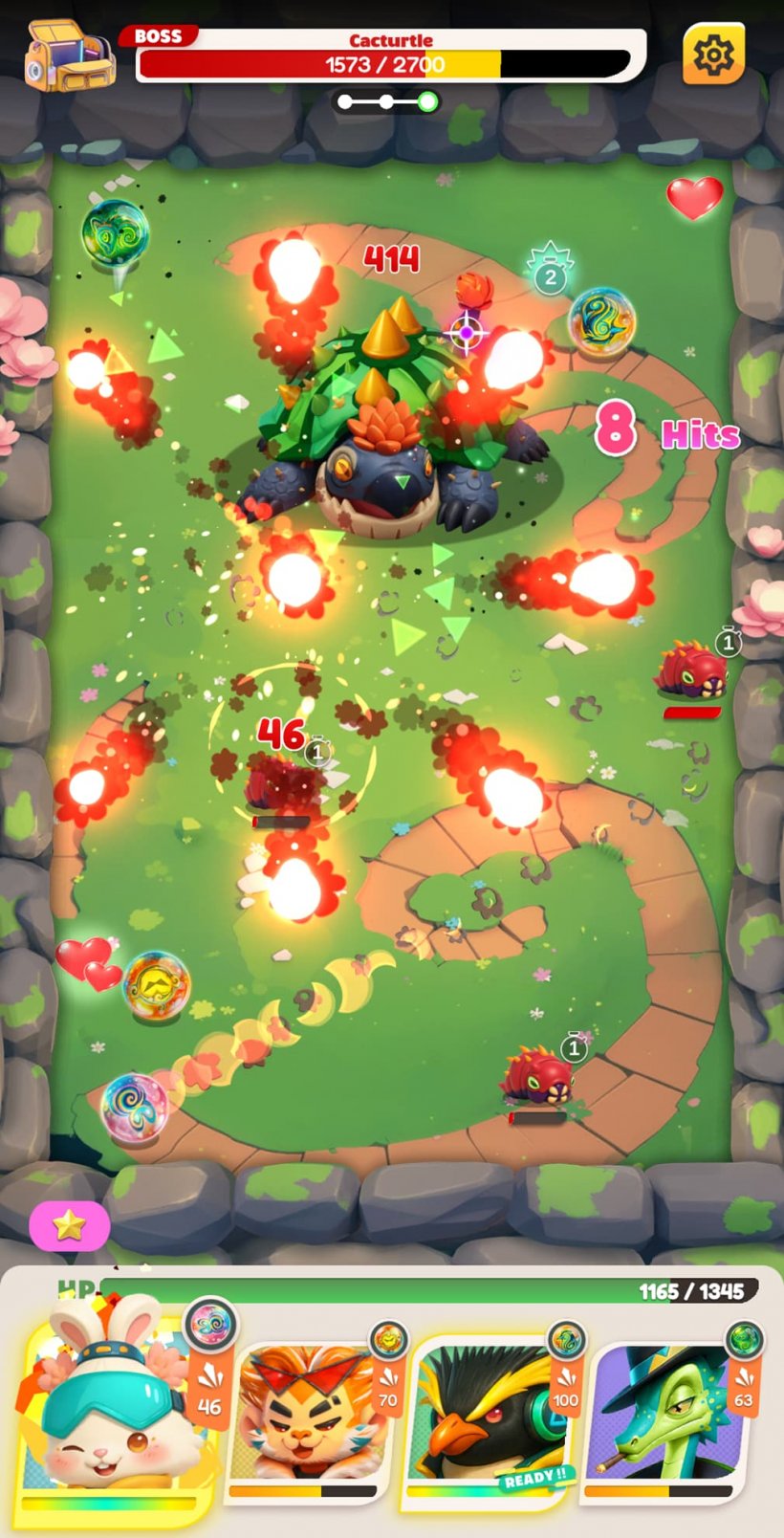 An image of a battlefield where colourful marbles are striking enemy monsters.