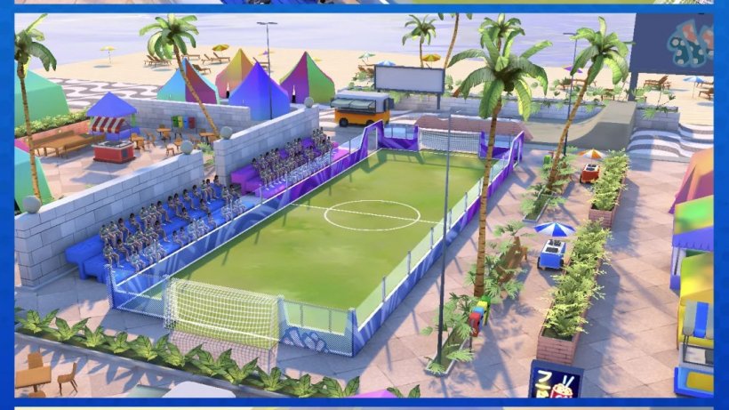 a football pitch with bleachers next to a beach