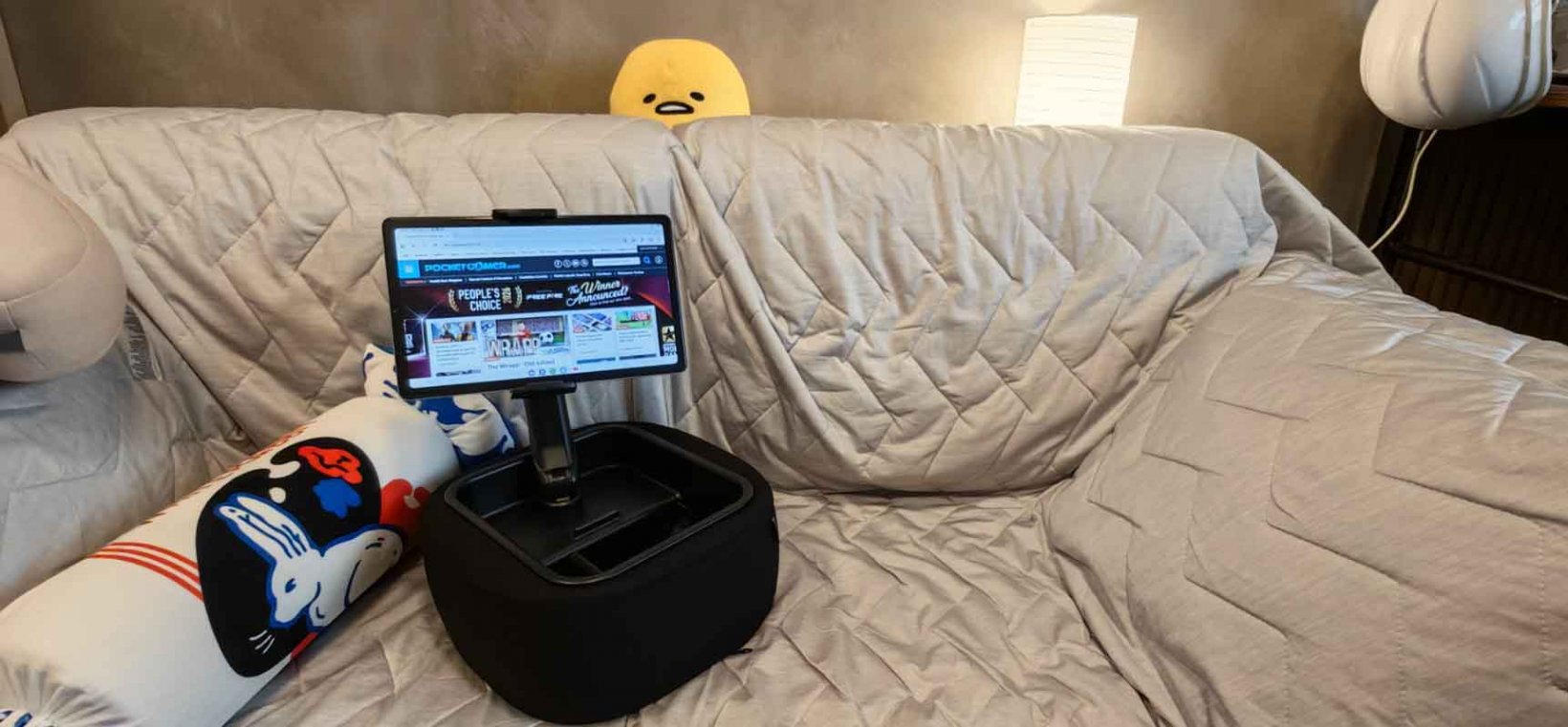 the gaming pillow stand on a couch