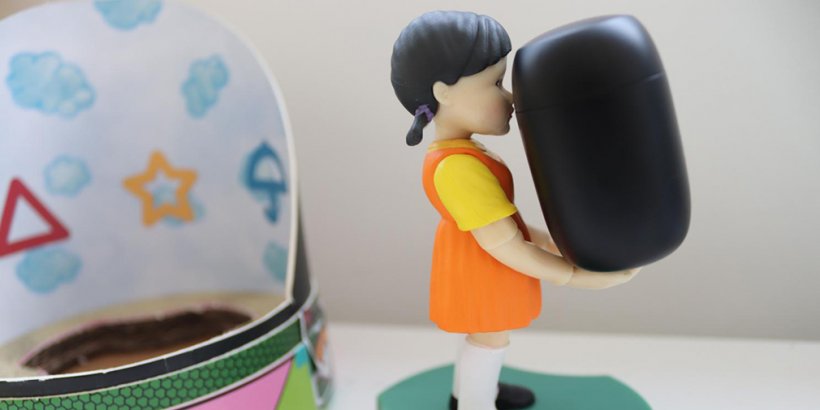 Young-Hee side view with a pair of earbuds