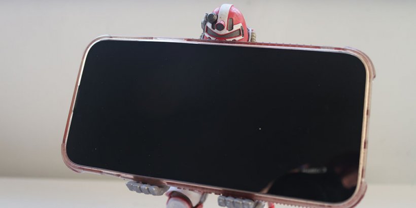 Nuka Cola Power Cable Guys holding a phone with his head peeking out