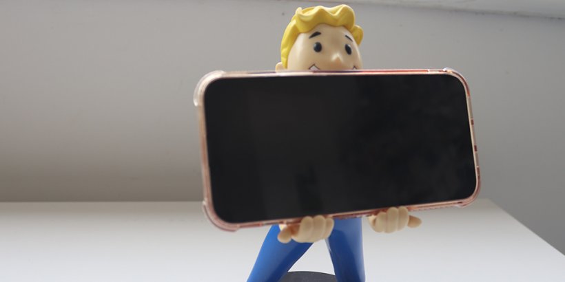 Vault Boy Fallout Cable Guys phone holder holding a phone