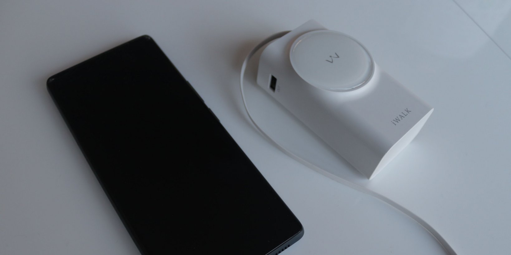 IWALK Reel Power Bank plugged into a phone