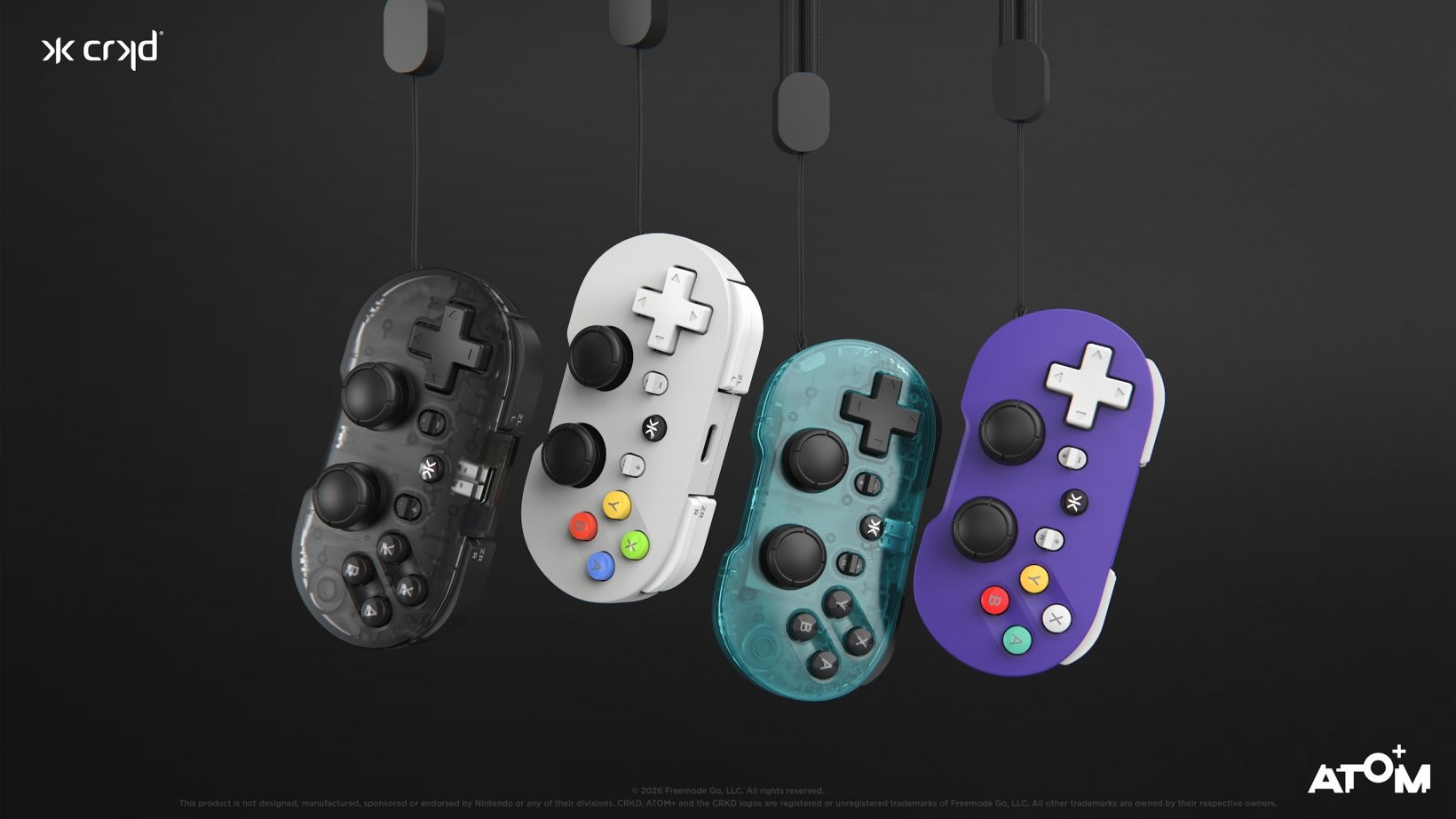 four crkd atom+ controllers in various colours lined up next to each other