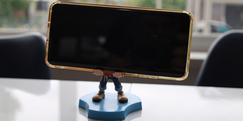 One Piece Luffy Cable Guys Holdems Mini holding a phone