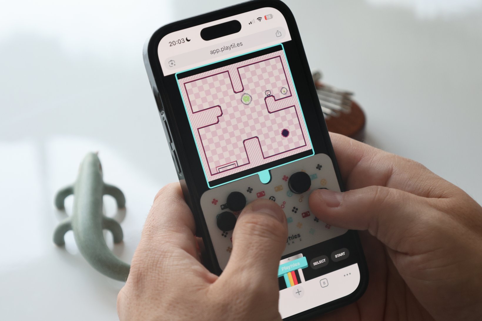 a phone playing playtiles on the screen